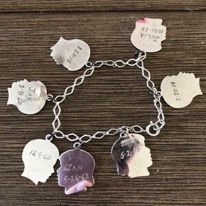 Vintage children's head charm bracelet